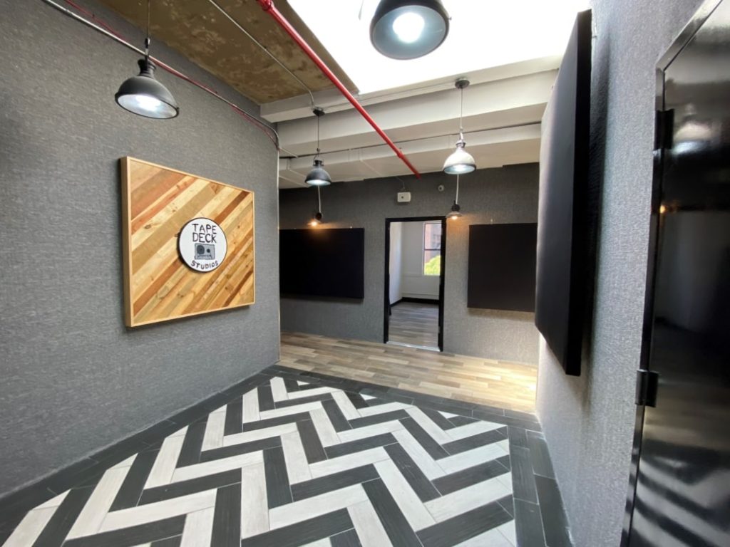 Tape Deck Studios sign in the secure, professionally designed common area of the Brooklyn facility.